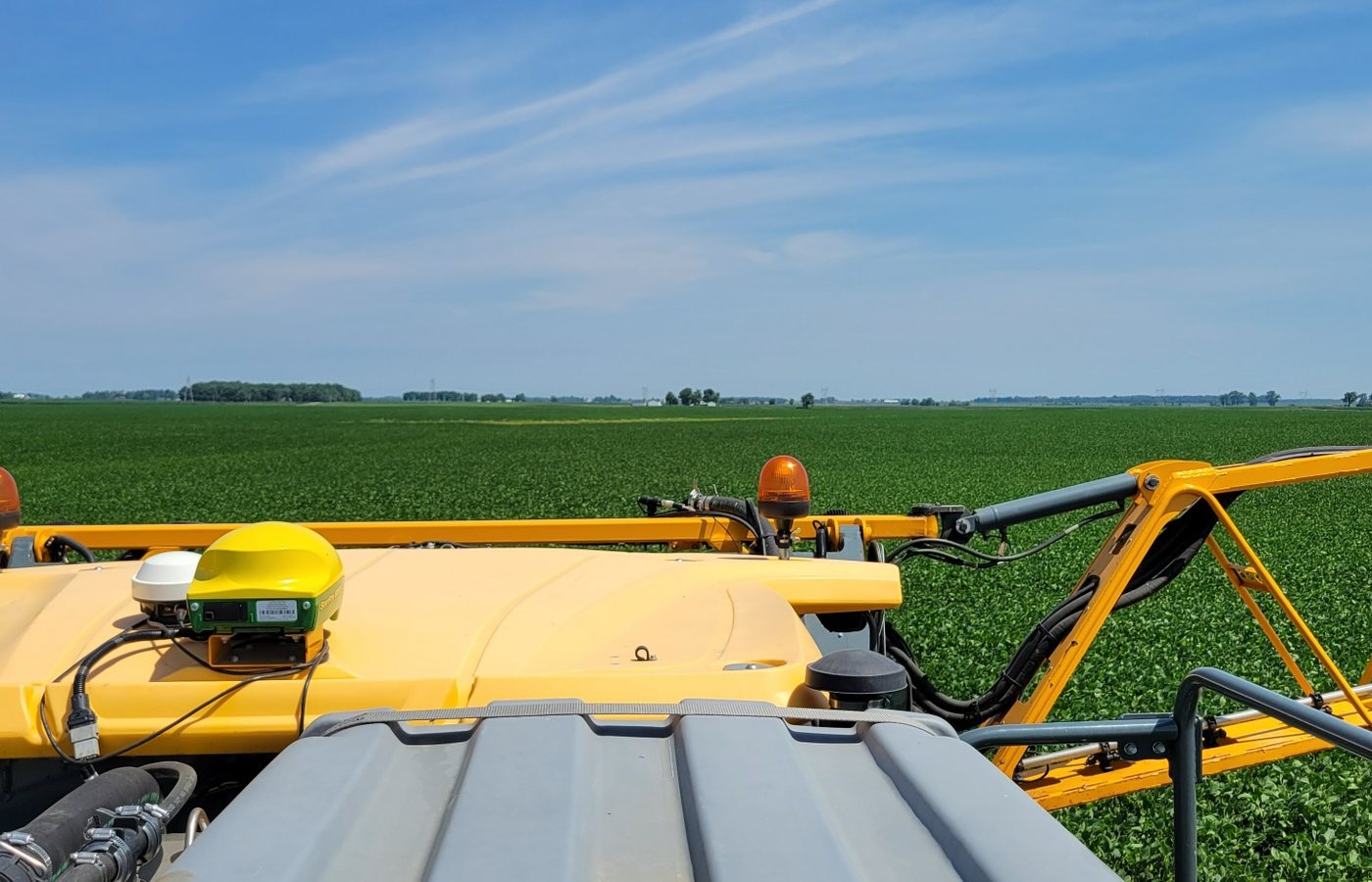 Sprayer boom making an in-season crop application